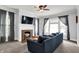 Bright living room showcasing large windows, a cozy fireplace, and comfortable blue sofa at 1000 E King St, Franklin, IN 46131