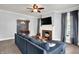 Comfortable living room with fireplace open to dining room, perfect for entertaining guests at 1000 E King St, Franklin, IN 46131