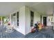 Spacious wrap-around porch with rocking chairs, perfect for relaxing and enjoying the outdoors at 1000 E King St, Franklin, IN 46131