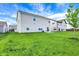 Lush backyard view of the light gray vinyl sided home at 10236 Arctic Edge Dr, Indianapolis, IN 46239