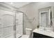 Modern bathroom with glass-enclosed shower, toilet, vanity with sink, and stylish fixtures at 10236 Arctic Edge Dr, Indianapolis, IN 46239