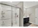 Modern bathroom with glass-enclosed shower, white fixtures, and stylish vanity with essential toiletries at 10236 Arctic Edge Dr, Indianapolis, IN 46239