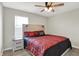 Inviting bedroom with a modern bed, stylish nightstand, soft lighting, and window view at 10236 Arctic Edge Dr, Indianapolis, IN 46239