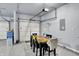 A clean, spacious garage with painted walls, epoxy floors and space for dining at 10236 Arctic Edge Dr, Indianapolis, IN 46239