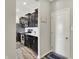 Well-organized kitchen with dark cabinetry, stainless appliances, and a side entrance at 10236 Arctic Edge Dr, Indianapolis, IN 46239