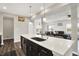 Open-concept kitchen with quartz countertop island and pendant lighting, perfect for entertaining guests at 10236 Arctic Edge Dr, Indianapolis, IN 46239