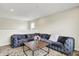 Bright living room with a large gray sectional sofa and a wooden coffee table at 10236 Arctic Edge Dr, Indianapolis, IN 46239