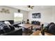 Cozy living room featuring plush sofas, a mounted TV, and lots of natural light from a large window at 10236 Arctic Edge Dr, Indianapolis, IN 46239