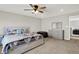 Bright main bedroom with a ceiling fan and a comfortable Queen bed at 10236 Arctic Edge Dr, Indianapolis, IN 46239