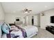 Bright main bedroom with a ceiling fan and a comfortable Queen bed at 10236 Arctic Edge Dr, Indianapolis, IN 46239