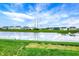 Beautiful backyard pond with clear reflections of the sky and surrounding homes at 10236 Arctic Edge Dr, Indianapolis, IN 46239