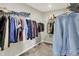 Organized walk-in closet with ample storage space and hanging racks for clothes and accessories at 10236 Arctic Edge Dr, Indianapolis, IN 46239