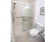 Bathroom featuring a glass shower door, toilet, and fixtures at 1046 Timber Creek Dr # 3, Carmel, IN 46032