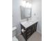 Contemporary bathroom with a black vanity, white countertop, framed mirror, and tile flooring at 1046 Timber Creek Dr # 3, Carmel, IN 46032