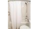 Clean bathroom with a shower-tub combination, white tile surround, and modern fixtures at 1046 Timber Creek Dr # 3, Carmel, IN 46032