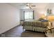 Bright bedroom featuring a ceiling fan, neutral walls, and a window with peaceful outdoor views at 1046 Timber Creek Dr # 3, Carmel, IN 46032