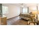 Bright bedroom featuring a ceiling fan, neutral walls, and a window with peaceful outdoor views at 1046 Timber Creek Dr # 3, Carmel, IN 46032