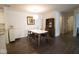Comfortable dining space with a modern table, stylish chairs, and adjacent living area at 1046 Timber Creek Dr # 3, Carmel, IN 46032