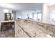 Open-concept kitchen with granite countertops and seamless transition to dining and living areas at 1046 Timber Creek Dr # 3, Carmel, IN 46032