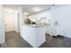 Modern kitchen featuring stainless steel appliances, granite countertops, and a breakfast bar at 1046 Timber Creek Dr # 3, Carmel, IN 46032