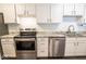 Modern kitchen features stainless steel appliances, sleek white cabinetry, and granite countertops at 1046 Timber Creek Dr # 3, Carmel, IN 46032