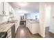 Open-concept kitchen features granite countertops, stainless steel appliances, and spacious dining area at 1046 Timber Creek Dr # 3, Carmel, IN 46032