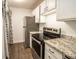 Efficient kitchen features stainless steel appliances, granite countertops, and ample cabinet space at 1046 Timber Creek Dr # 3, Carmel, IN 46032