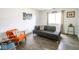 Relaxing living room with comfortable seating, artistic decor, and a sunlit window with wood plank flooring at 1046 Timber Creek Dr # 3, Carmel, IN 46032