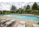 Relaxing pool with lounge chairs for community enjoyment at 1046 Timber Creek Dr # 3, Carmel, IN 46032
