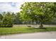 Exterior shot of the community tennis court with mature trees at 1046 Timber Creek Dr # 3, Carmel, IN 46032