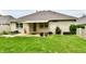 Inviting backyard with patio area, ideal for outdoor gatherings and relaxation within lush green surroundings at 10713 Stable Dr, Indianapolis, IN 46239