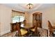 Dining room featuring wooden furniture, large window and a decorative light fixture at 10713 Stable Dr, Indianapolis, IN 46239
