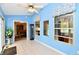 Florida room with windows and tile flooring, leads to the dining room at 10713 Stable Dr, Indianapolis, IN 46239