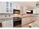 Bright updated kitchen featuring white cabinets, new appliances, and stylish countertops at 10713 Stable Dr, Indianapolis, IN 46239
