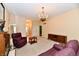 Large and bright living room featuring neutral paint, chandelier, and nice decor at 10713 Stable Dr, Indianapolis, IN 46239