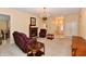 Spacious living room with carpet flooring, a fireplace, chandelier, and recessed lighting at 10713 Stable Dr, Indianapolis, IN 46239