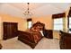 Spacious main bedroom with a chandelier, carpeted floors and two windows with coverings at 10713 Stable Dr, Indianapolis, IN 46239