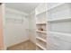 Well-organized walk-in closet featuring custom shelving and wire racks for efficient storage of clothing and accessories at 10713 Stable Dr, Indianapolis, IN 46239