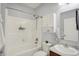 Bathroom featuring a bath tub, sink, toilet, shower head and shelving at 1118 Kristi Ct, Greenwood, IN 46142
