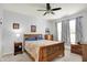 Comfortable bedroom with a wooden bed frame, cozy quilt, and natural light from the windows at 1118 Kristi Ct, Greenwood, IN 46142