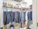 Closet with various boxes, storage containers and clothes on hangers at 1118 Kristi Ct, Greenwood, IN 46142