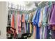 Walk-in closet with rows of hanging clothes on hangers and shelving at 1118 Kristi Ct, Greenwood, IN 46142