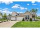 Attractive home featuring a well-maintained lawn, long driveway, and lovely landscaping at 1118 Kristi Ct, Greenwood, IN 46142