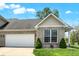 Charming brick home featuring a two-car garage, well-maintained lawn, and inviting curb appeal at 1118 Kristi Ct, Greenwood, IN 46142