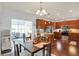 Open concept kitchen with wood cabinets, stainless steel appliances, and adjacent dining area at 1118 Kristi Ct, Greenwood, IN 46142