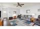 Cozy living room featuring comfortable seating, a ceiling fan, and a stylish area rug at 1118 Kristi Ct, Greenwood, IN 46142