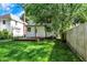 Spacious backyard with a wooden deck and well-maintained lawn at 1124 E 35Th St, Indianapolis, IN 46205