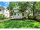 Picture of a spacious backyard with a well-maintained lawn and a wooden deck at 1124 E 35Th St, Indianapolis, IN 46205