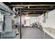 Spacious unfinished basement with painted ceilings, shelving, concrete floors, bikes, and heater at 1124 E 35Th St, Indianapolis, IN 46205