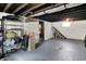 Spacious unfinished basement with painted ceilings, shelving, concrete floors, and stairs at 1124 E 35Th St, Indianapolis, IN 46205